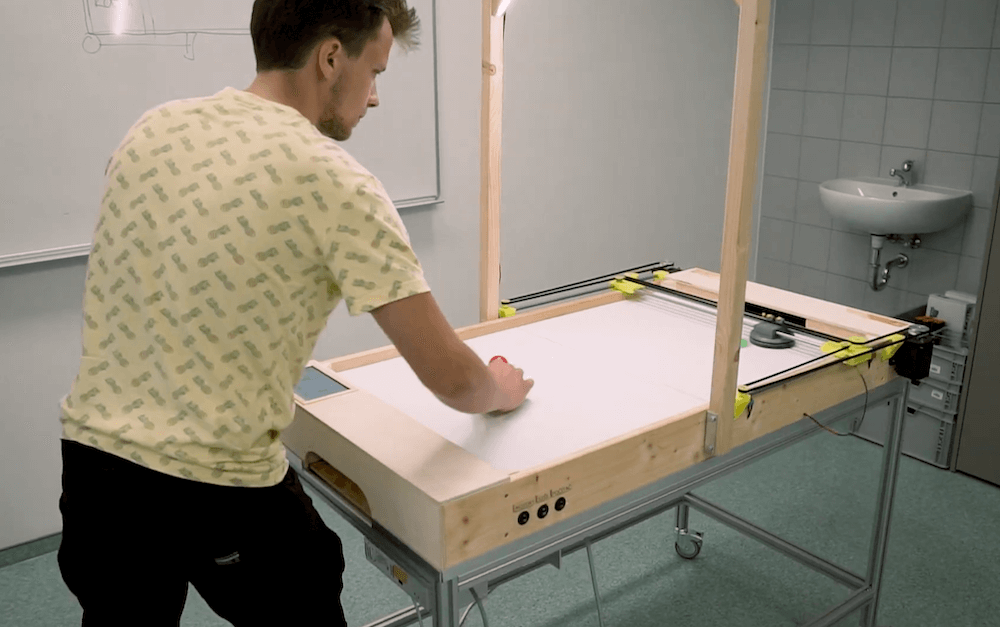 Learn about an Arduino-controlled air hockey robotic player!