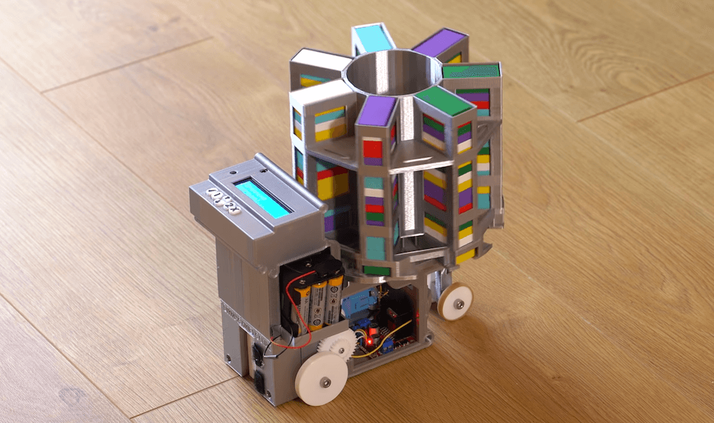 This machine stacks dominoes automatically