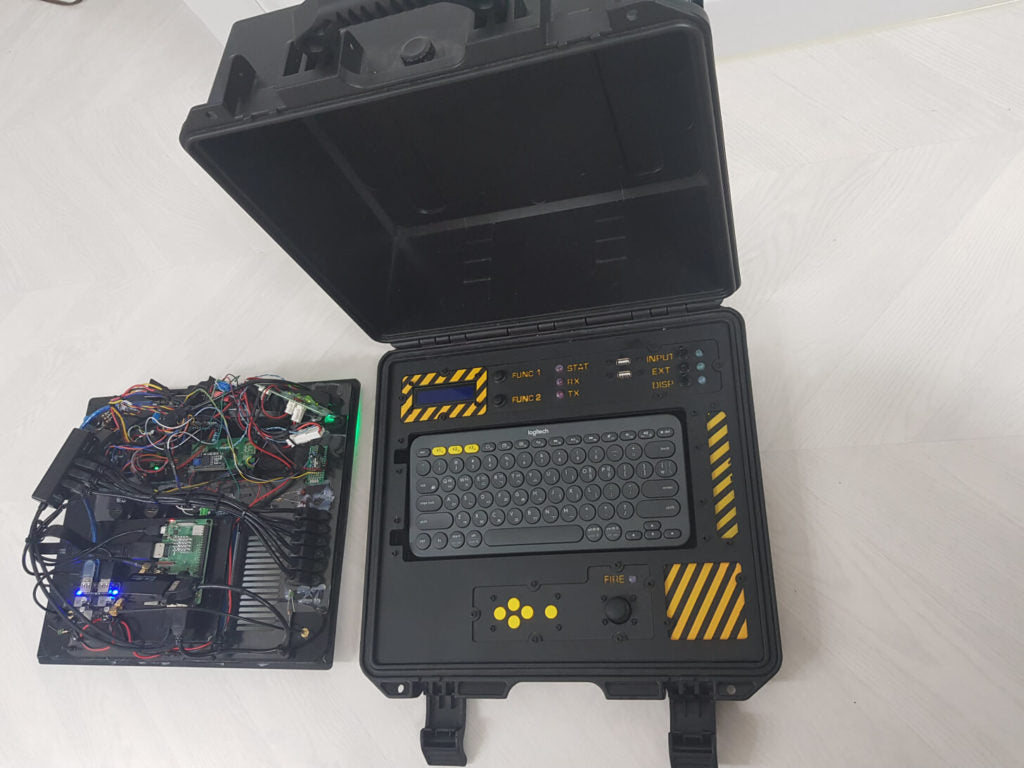 A military-looking cyberdeck with a built-in Geiger counter