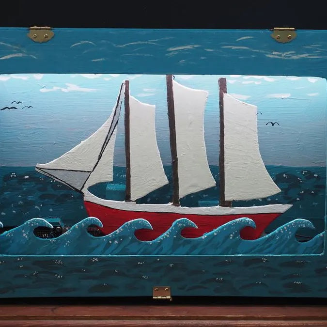 This automated diorama shows a sailboat at sea