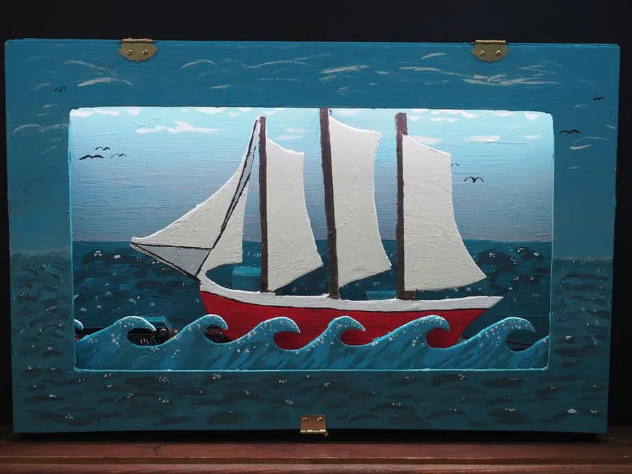 This automated diorama shows a sailboat at sea