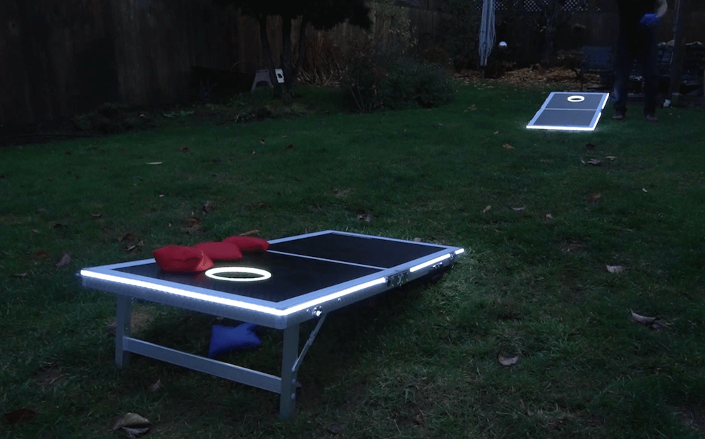 These cornhole boards react to your bean bag tosses