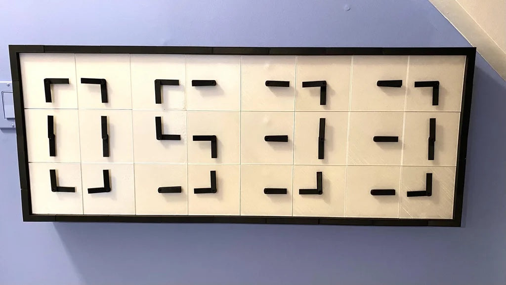 This digital clock uses 24 Arduino-controlled analog faces
