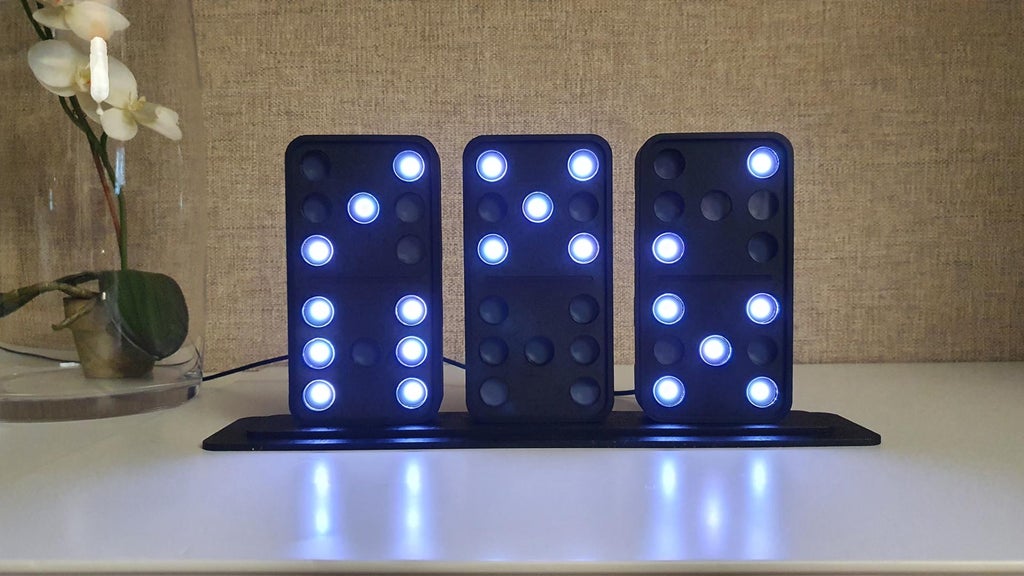 This DIY domino clock tells the time using three LED-lit tiles