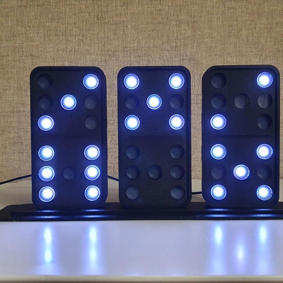 This DIY domino clock tells the time using three LED-lit tiles