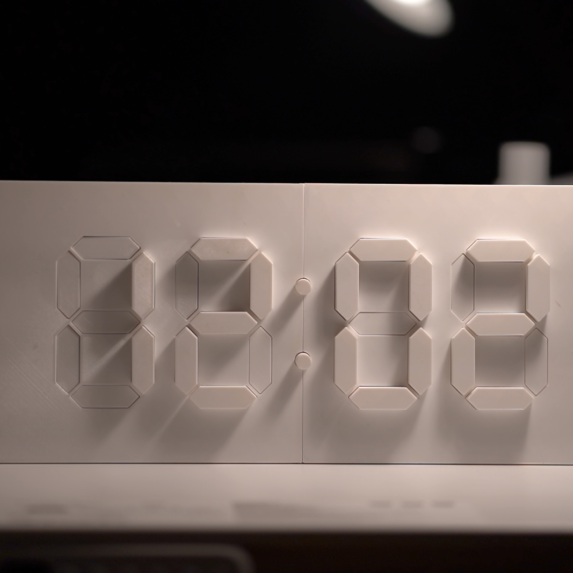Kinetic digital clock takes 7-segment displays to another dimension
