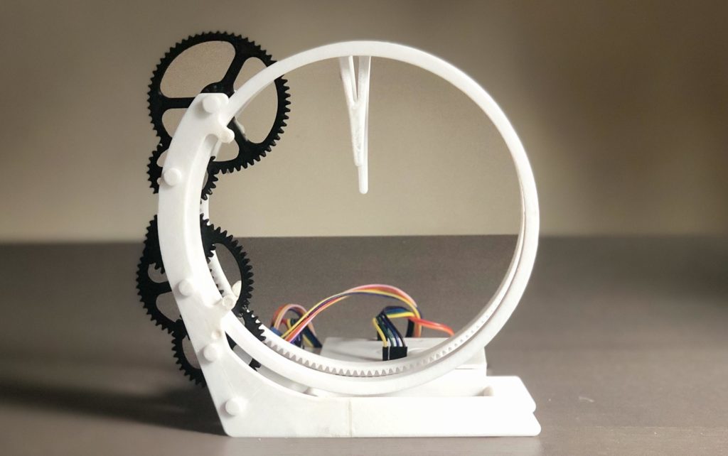 Holo Clock is a novel 3D-printed clock that tells time using a pair of rings