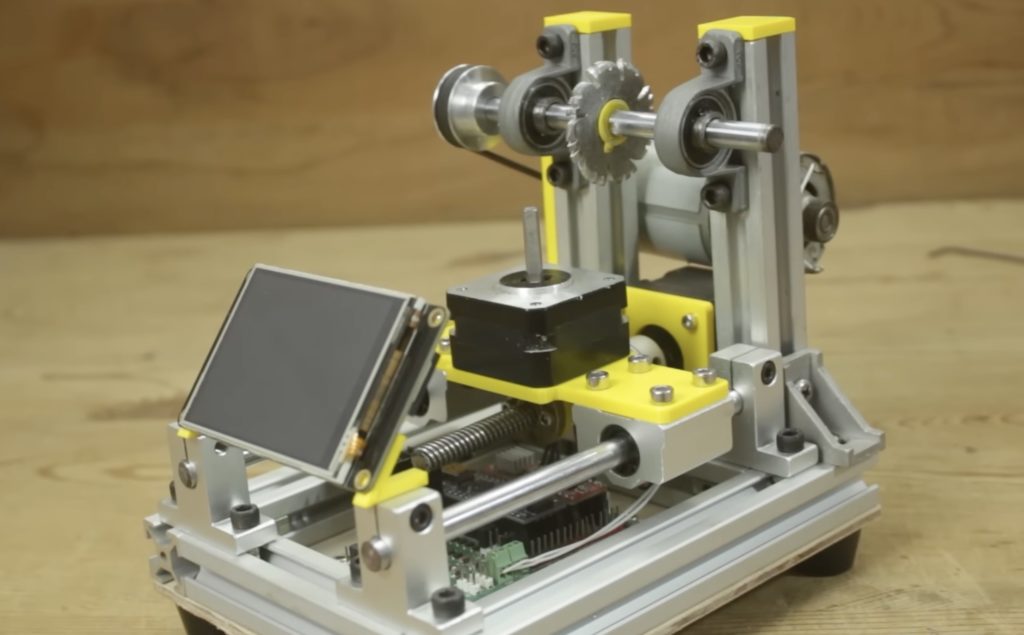 This handy machine automatically cuts plastic gears