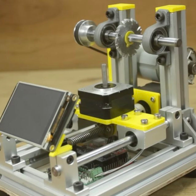 This handy machine automatically cuts plastic gears