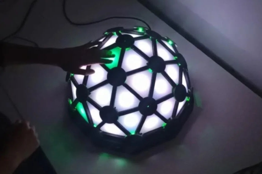 Play Simon and the piano on this glowing geodesic dome