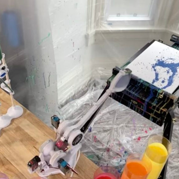 Flingbot is a robot that flings paint at a canvas to create art