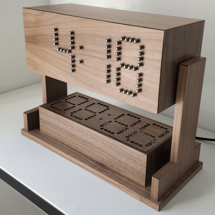 This mechanical clock tells time using steel balls