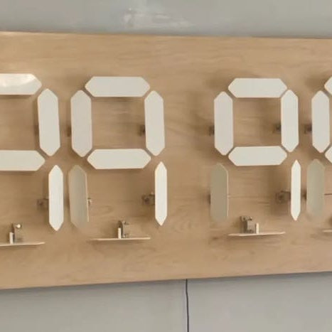 Charlie Sheen "Helps" Design a Seven-Segment Mechanical Clock